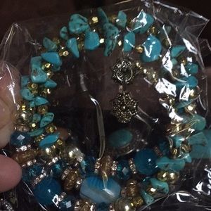 Blue and gold bracelet with multiple beads & stone